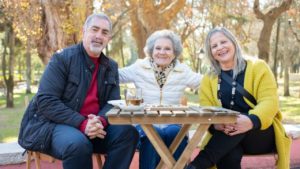 2 senior women, one man at a park bench - home care cdpap agency