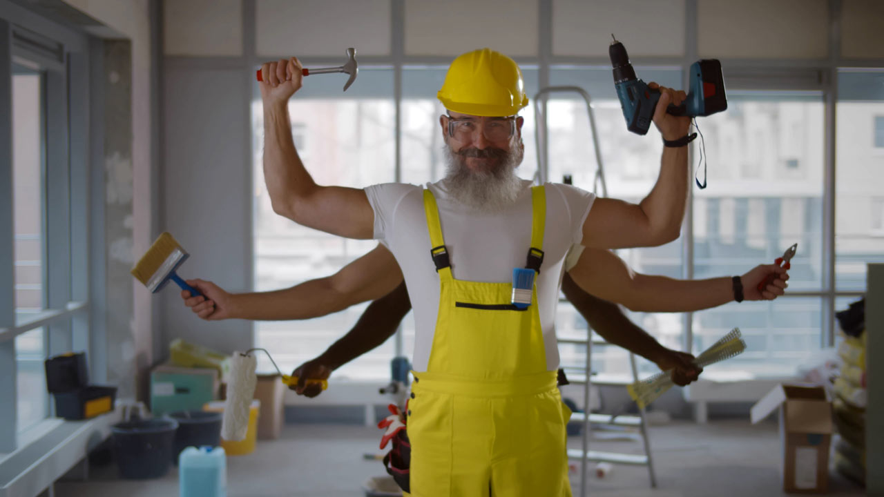 a senior builder with many arms holding tools